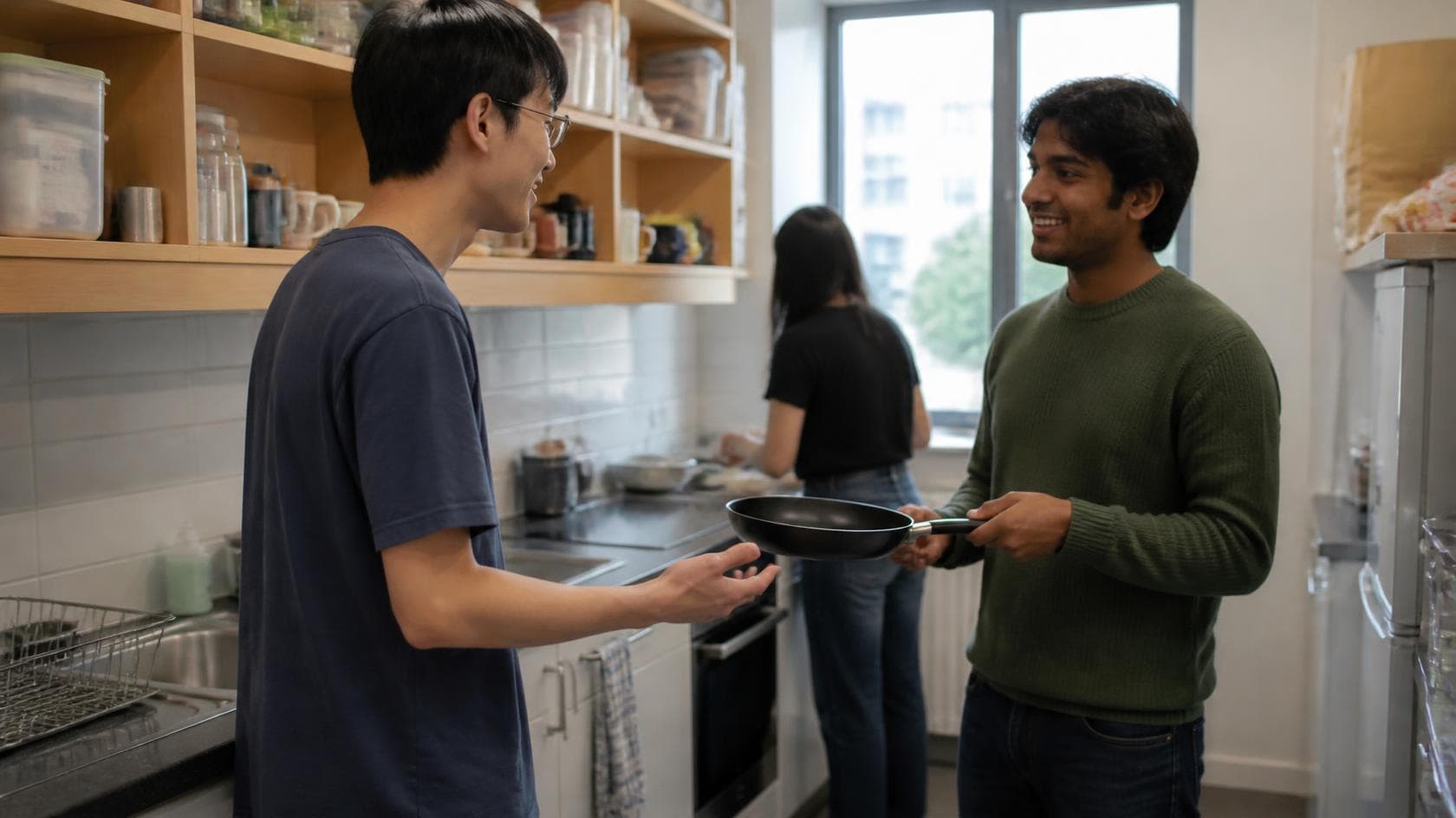 Student asking a flatmate before borrowing a kitchen item